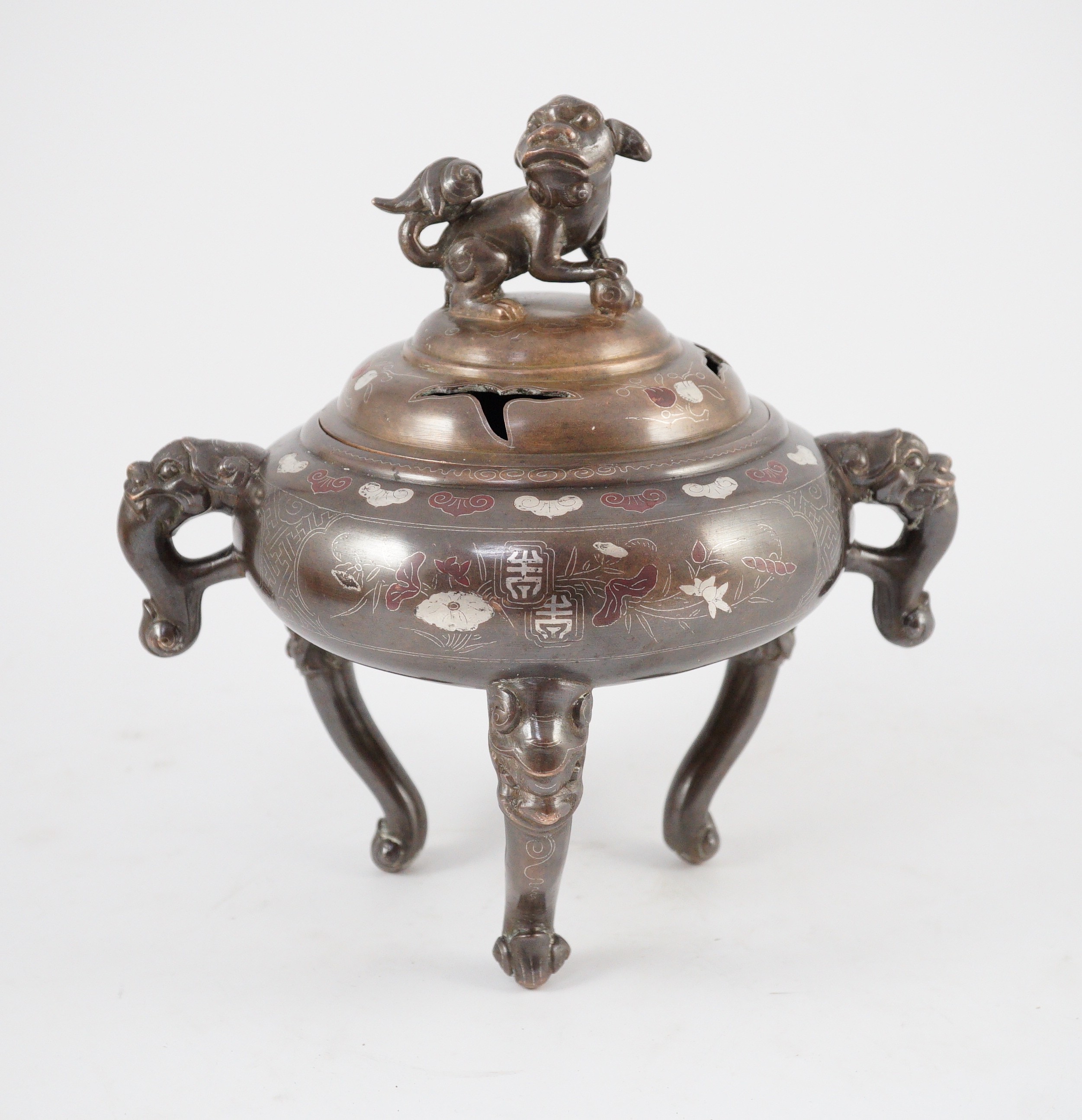 A Vietnamese silver inlaid bronze tripod censer and cover, 19th century, 24cm high, 24cm wide